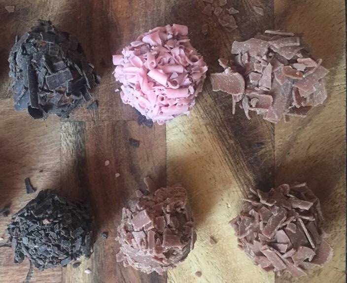 6 chocolates on a chopping board
