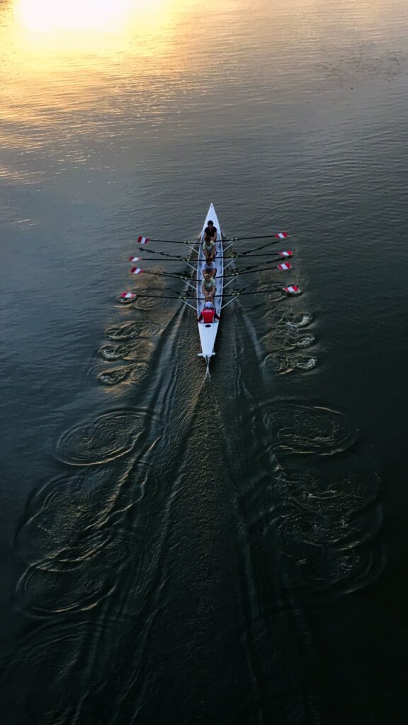 A rowing boat with rowers in it