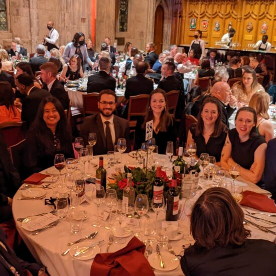 10 Renaisi colleagues sitting around a round table at the awards event