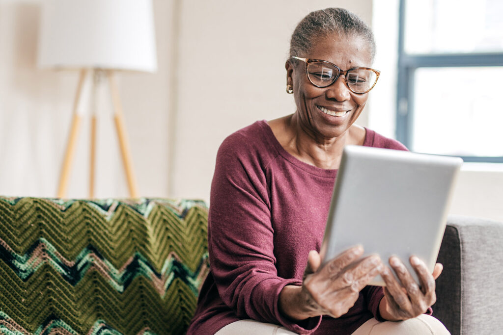 older woman looking at an ipad