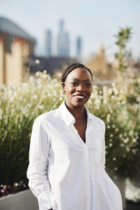 Natsayi Sithole standing in a garden