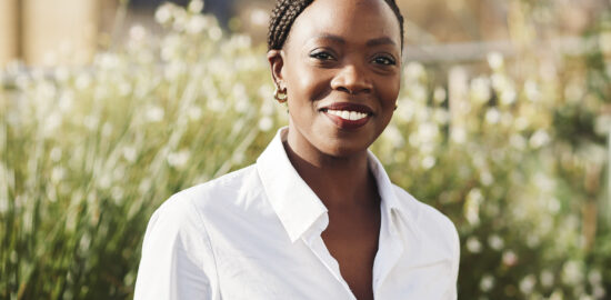 Natsayi Sithole standing in a garden