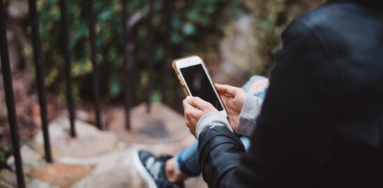 Person holding a mobile phone