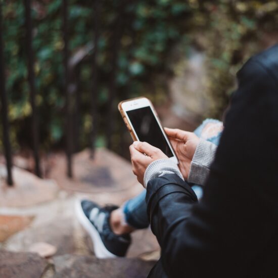Person holding a mobile phone