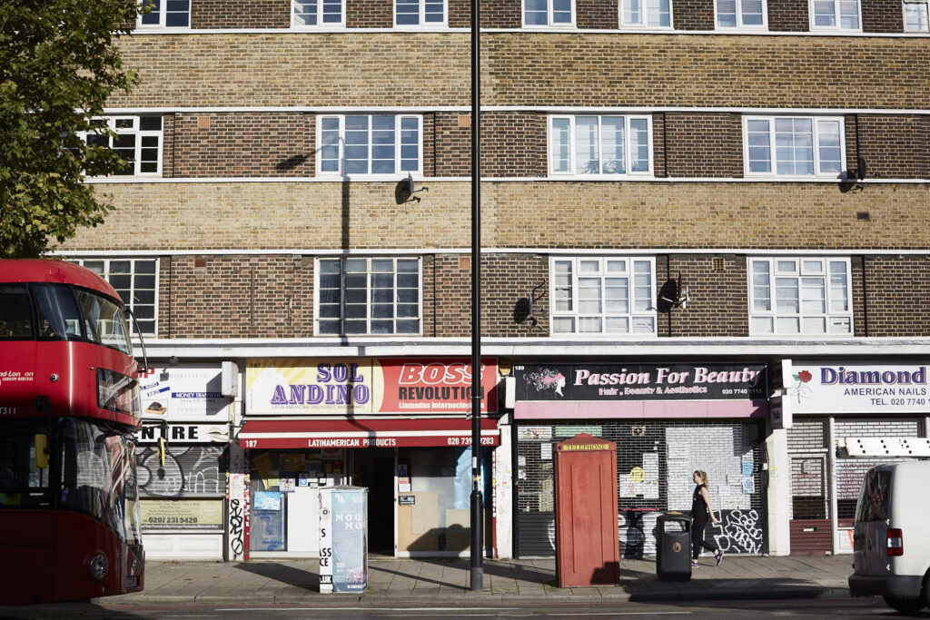 A row of shops with flats above it.
